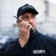 Security Guard Talking On Radio