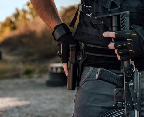 Close-up image of a heavily armed man