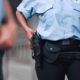 Security guard walking with firearm in holster